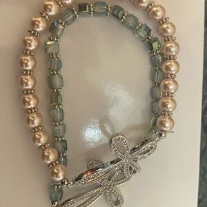 Two separate Cross Pearl and Crystal Bracelets